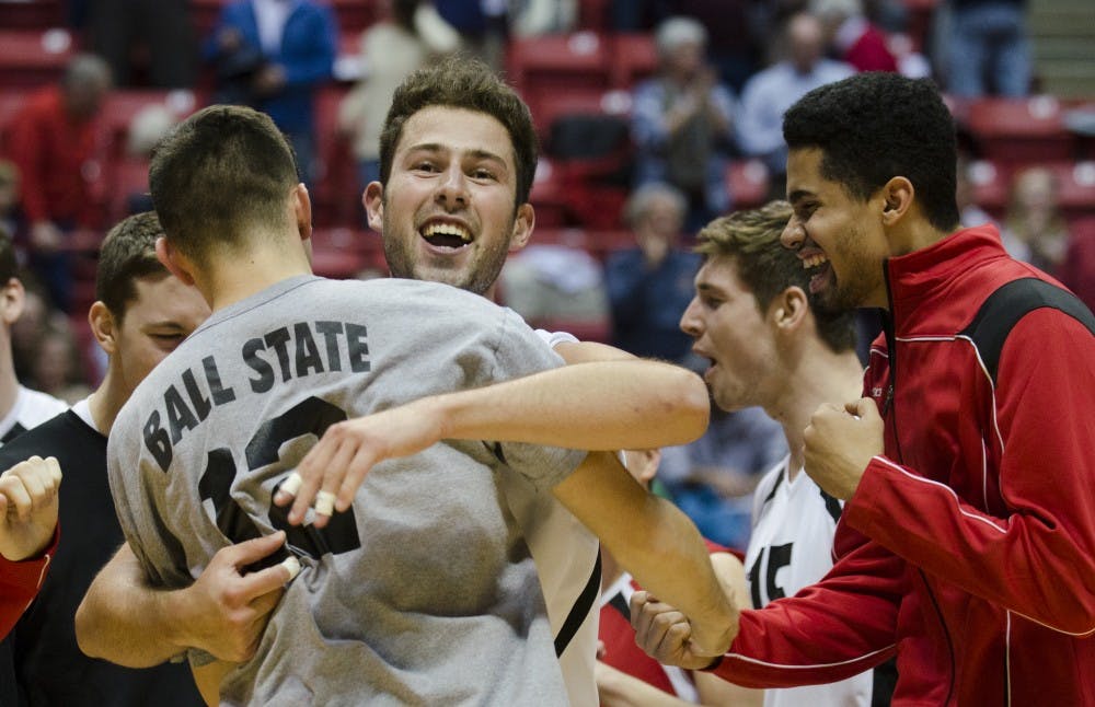 Members of the men's volleyball react after winning the match against Harvard 3-1 on Jan. 15 in Worthen Arena. DN PHOTO EMMA ROGERS