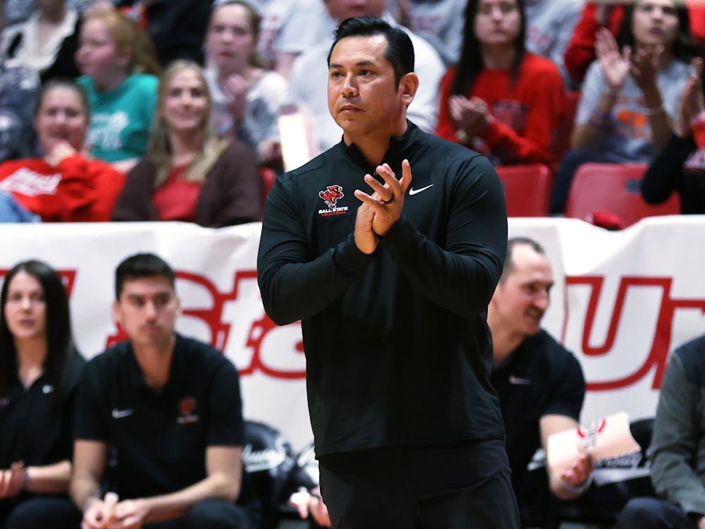 Ball State men's volleyball Head Coach Donan Cruz claps on the sidelines in a game against Ohio State in MIVA Tournament Finals April 22 at Worthen Arena. Ball State fell to Ohio State 3-1. Amber Pietz, DN