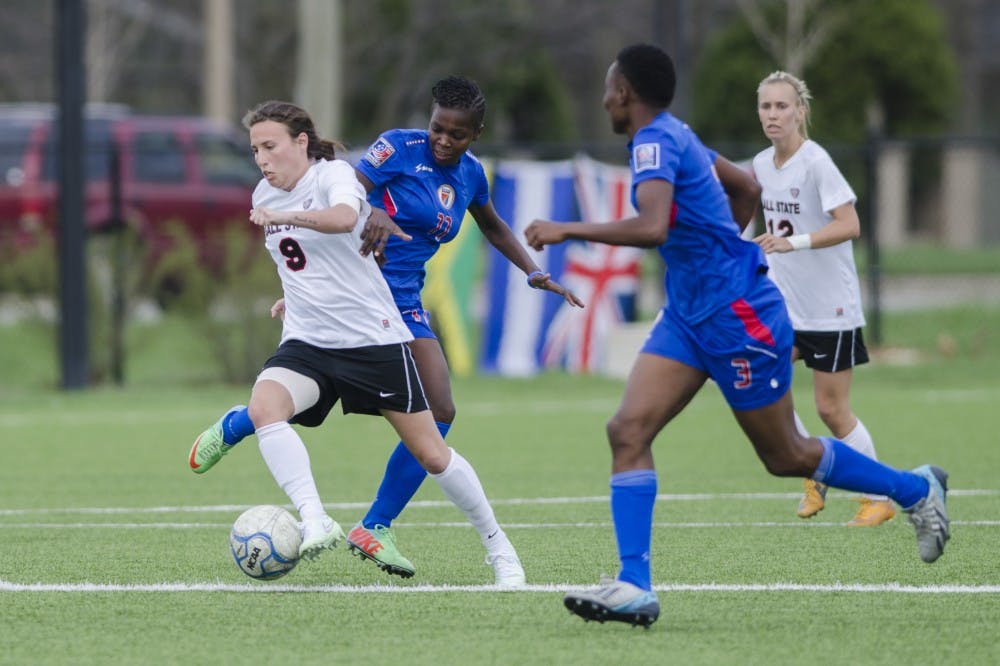 Redshirt junior Chelsy Swackhamer attempts to keep the ball away from members of the Haiti National team during the game on April 12 at the Briner Sports Complex. DN PHOTO BREANNA DAUGHERTY