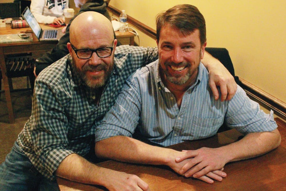 Martin Wood and Sam Crimmins sit together at Mo’Joe Coffeehouse in downtown Indianapolis. Wood, an associate professor in physiology and health science, has been with Crimmins, his partner, for five years. DN PHOTO RYAN HOWE