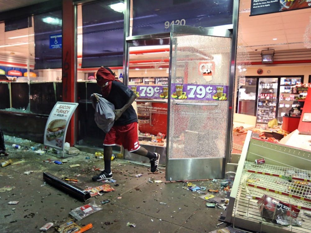 The QuikTrip in the 9400 block of Florissant Road is looted on Sunday, Aug. 10, 2014, one day after a Ferguson officer shot and killed Michael Brown in Ferguson, Mo. (David Carson/St. Louis Post-Dispatch/MCT) 