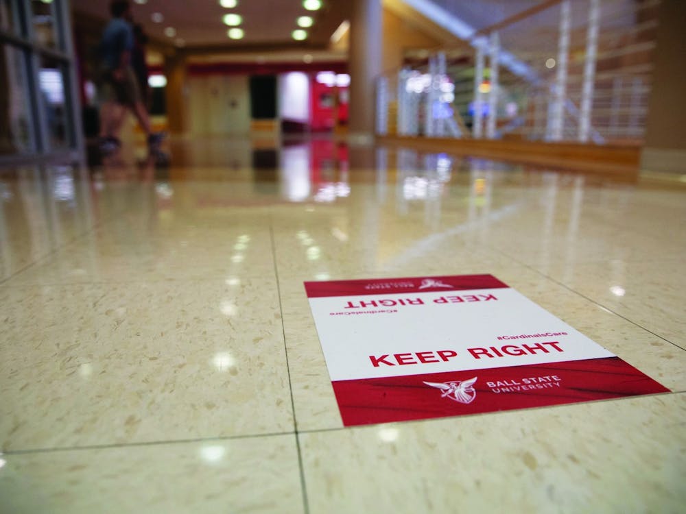 Signs directing people to walk on the right side of hallways were put up around Ball State University to keep people on one side of the path they are walking on. Jacob Musselman, DN