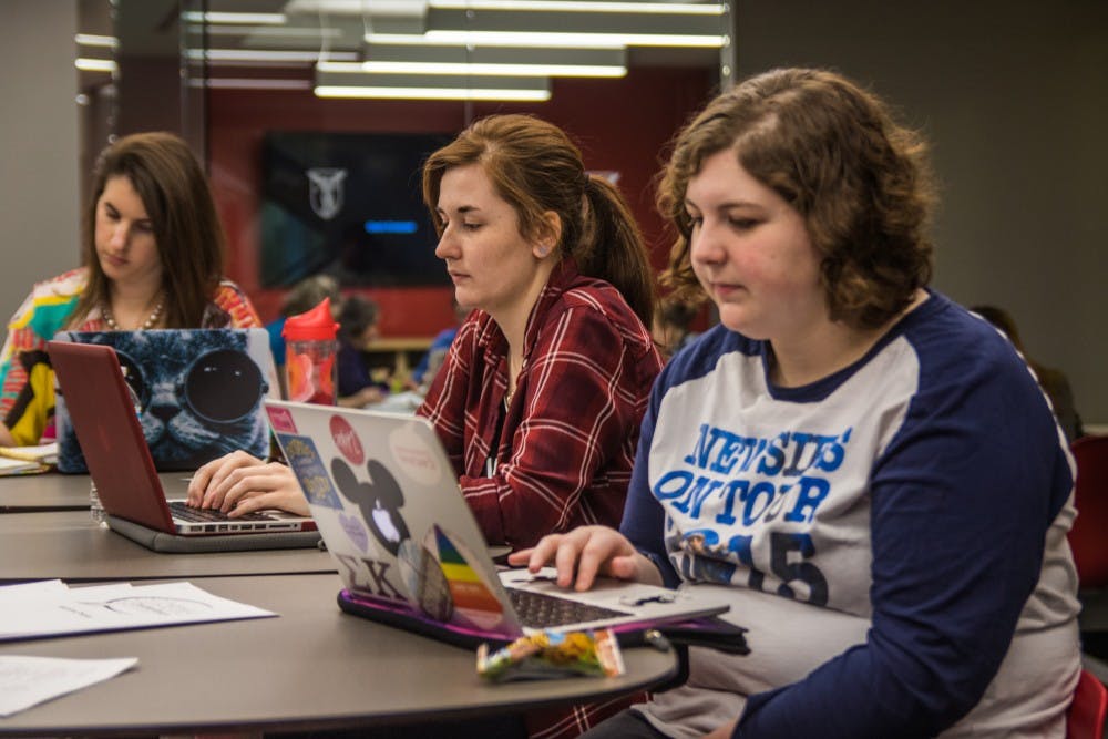 Members of Cardinal Communications, a Ball State student-run public relations agency, brainstorm ideas for local nonprofits during their first CreatAthon in the Holden Strategic Communications Center on March 24. The 24-hour event allowed students to use their professional skills to create new advertising and marketing solutions for the Animal Rescue Fund, Little Red Door and YWCA. Reagan Allen // DN