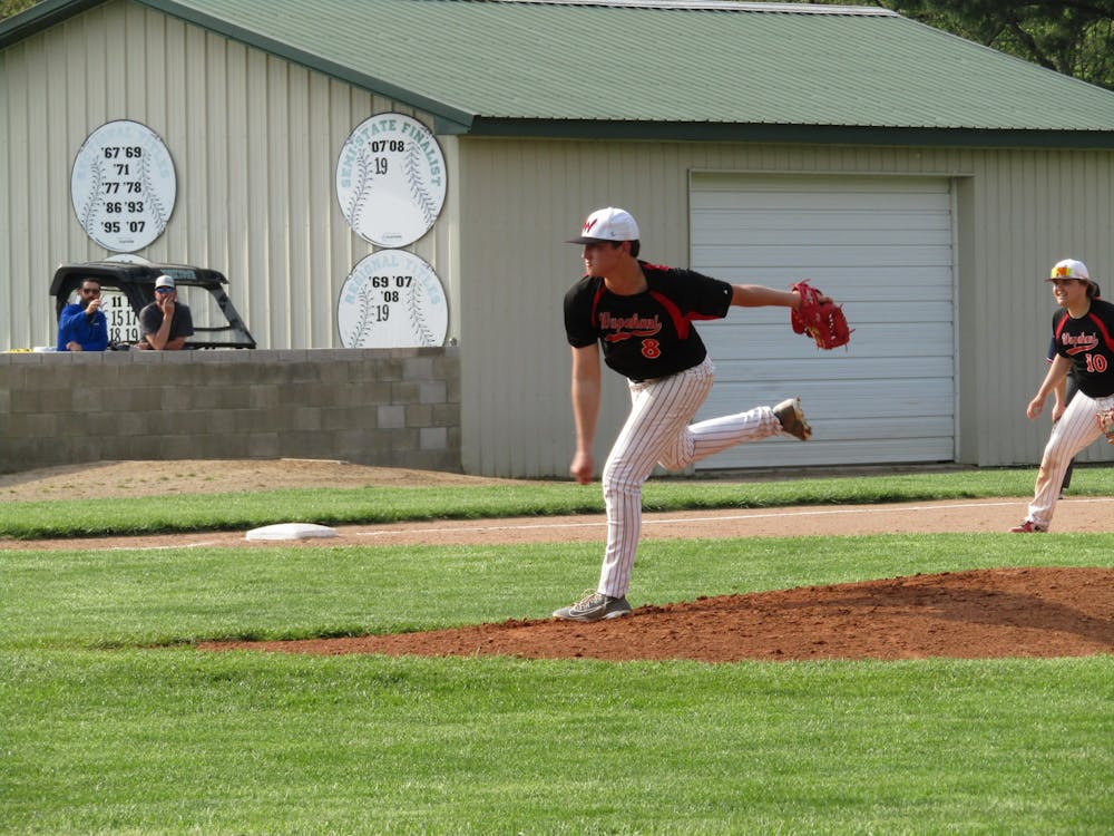 Wapahani junior pitcher Gavin Lash fires a pitch during the Raiders' game one matchup against Cowan in the Delaware County Baseball Tournament in Yorktown, Indiana. Lash and the Raiders picked up the win 12-1. 