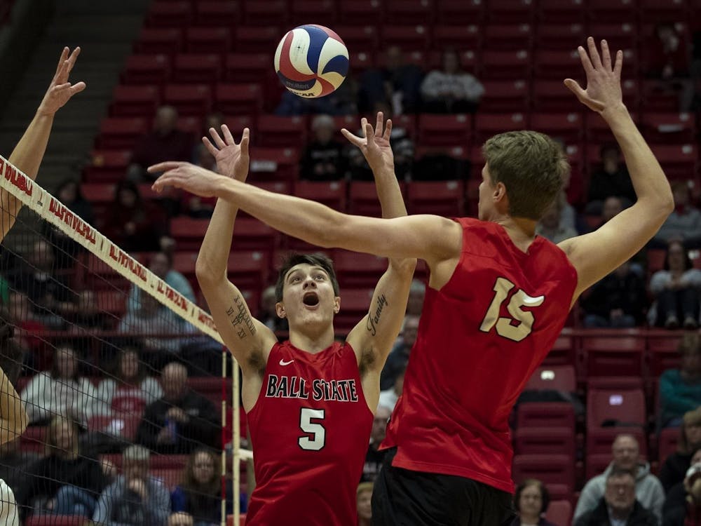 Junior setter Quinn Isaacson sets a ball for a teammate March 2, 2019, in a match against Quincy in John E. Worthen Arena. The Cardinals won the match in a 3-0 sweep. Ball State Athletics, Photo Provided
