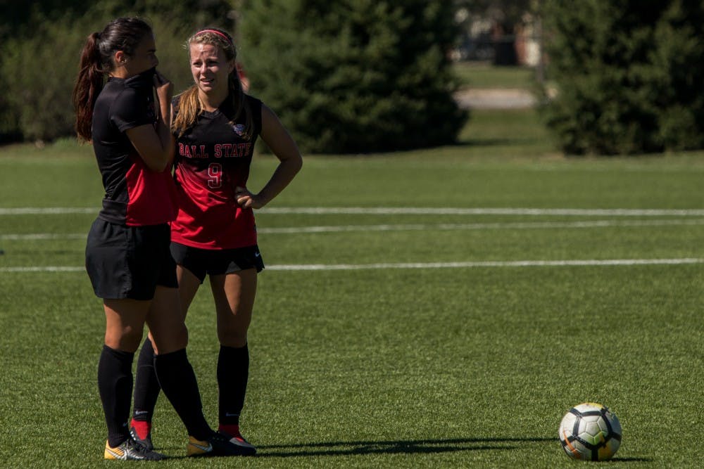 Seniors Paula Guerrero and Allison Abbe strategize before making the next play after Bowling Green received a yellow card Sept. 23, 2018, at Briner Sports Complex. Yellow cards are given to players who are cautioned on potentially dangerous plays and are out of the game if they receive two cautions. Eric Pritchett,DN