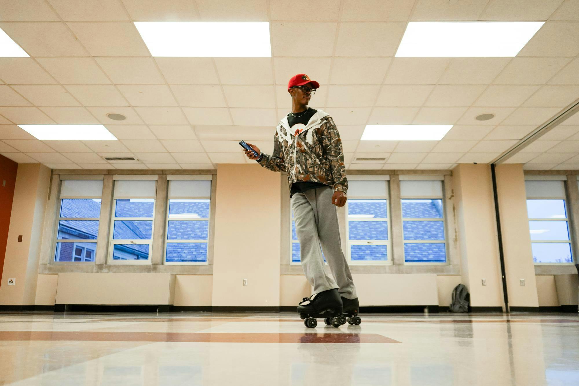 Ashton Cook skates around the room warming up to music Oct. 29 in the Student Center. Isabella Kemper, DN