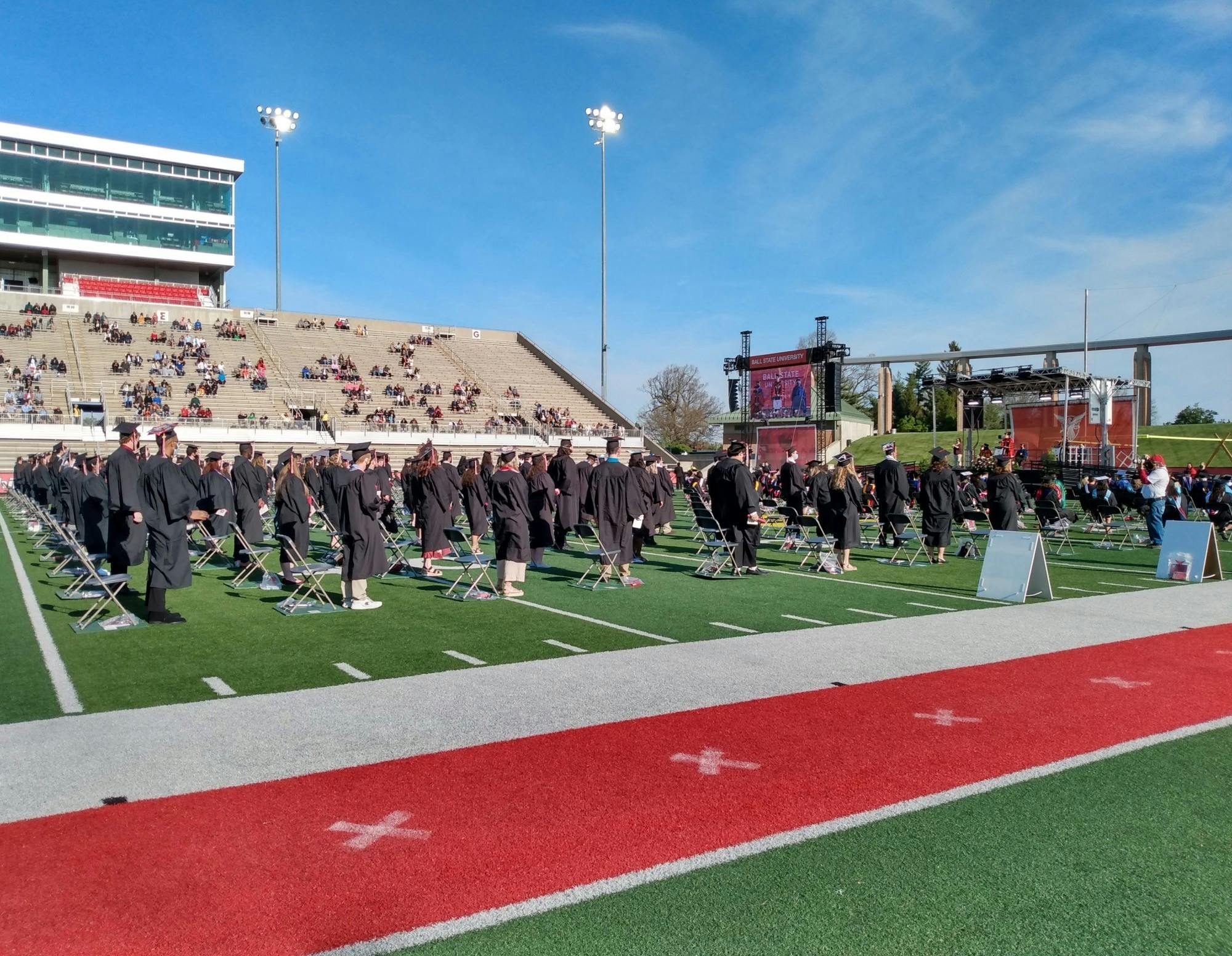 Ball State graduates from the classes of 2020 gather on the Scheumann Stadium turf May 15, 2021. Due to COVID-19, the university delayed commencement for a year, but invited graduates back to campus for a ceremony in spring 2021. Maya Wilkins, DN File