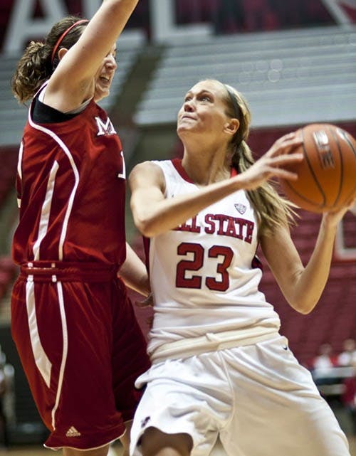 Sophomore guard Brittany Carter attempts to push past Miami for the shot attempt. Her performance has improved since the start of conference play. DN FILE PHOTO JONATHAN MIKSANEK