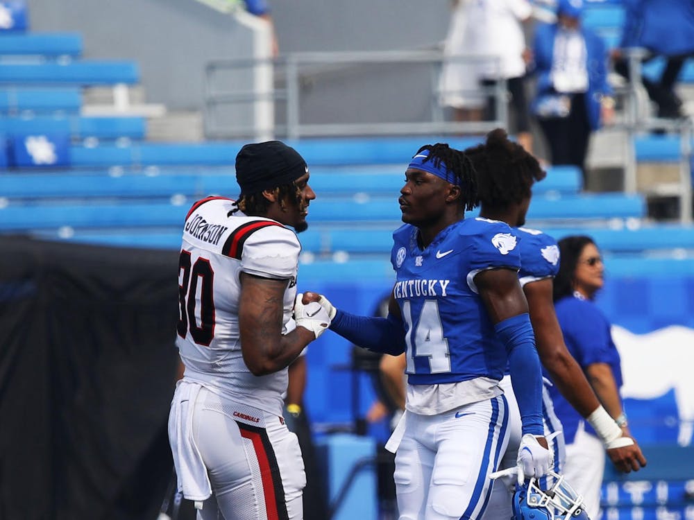 Caden Johnson speaking with Ty Bryant after Ball State's 44-14 loss to Kentucky Sept. 2 at Kroger Field. Johnson went to Fredrick Douglas High School in Lexington, Kentucky, with Bryant. Mya Cataline, DN