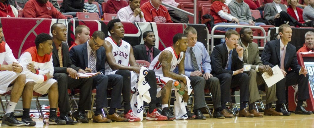 Head coach James Whitford talks with sophomore guard Zavier Turner on the bench during the game against Bowling Green on Feb. 14 at Worthen Arena. DN PHOTO BREANNA DAUGHERTY