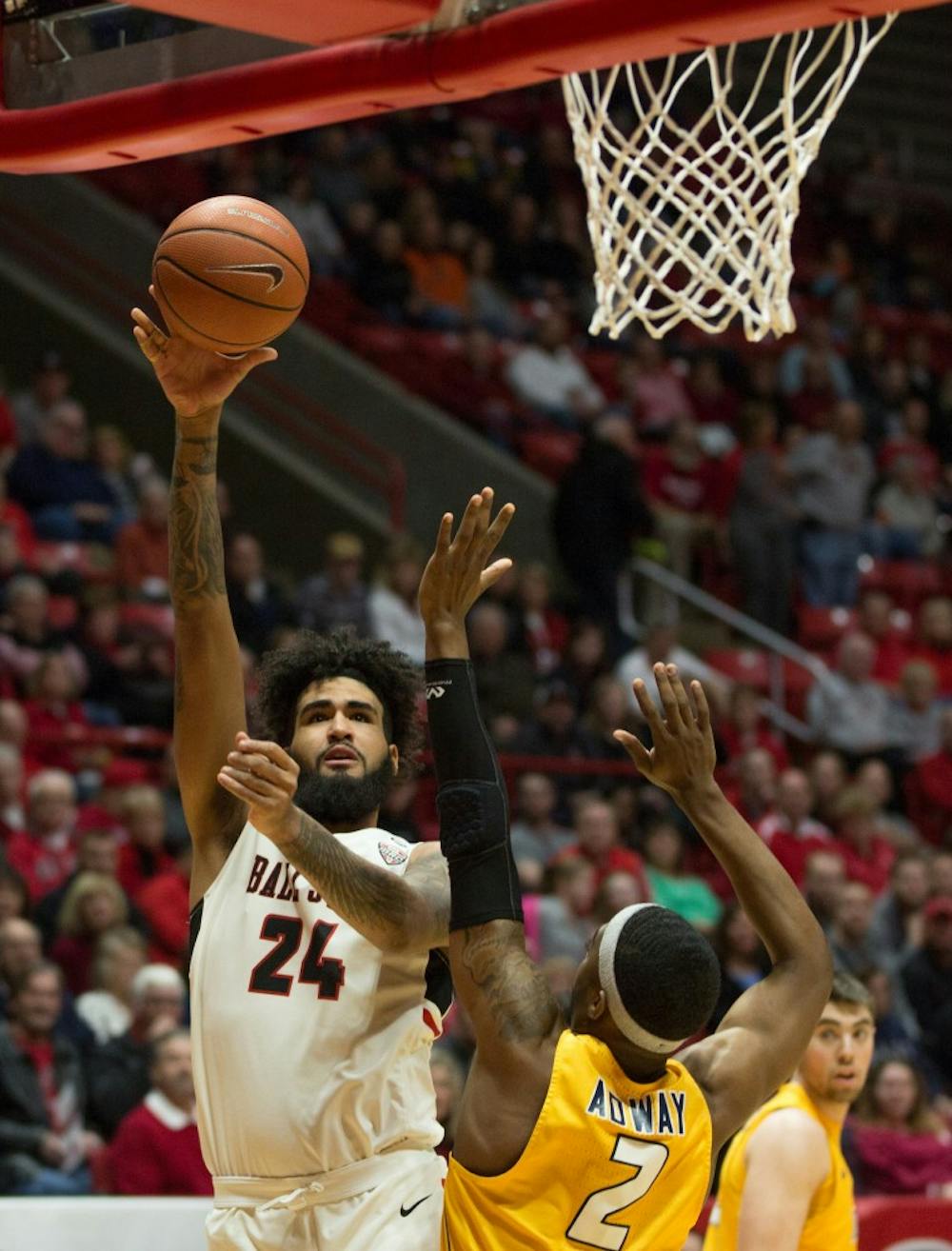 Junior Trey Moses goes in for a basket durring the first half of the against Toledo, OH. The cardinals were able to score 10 points before the Toledo rockets made a point. Worthen Arena, Feb. 17. Eric Pritchett, DN