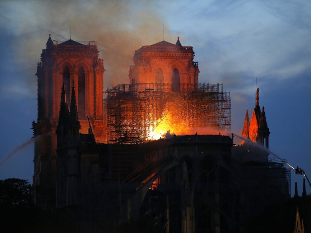 Smoke and flames rise from the Notre Dame Cathedral April 15, 2019, in Paris after a fire broke out Monday afternoon and quickly spread across the building, collapsing the spire. The cause is yet unknown but officials said it was possibly linked to ongoing renovation work.(AP Photo/Michel Euler)