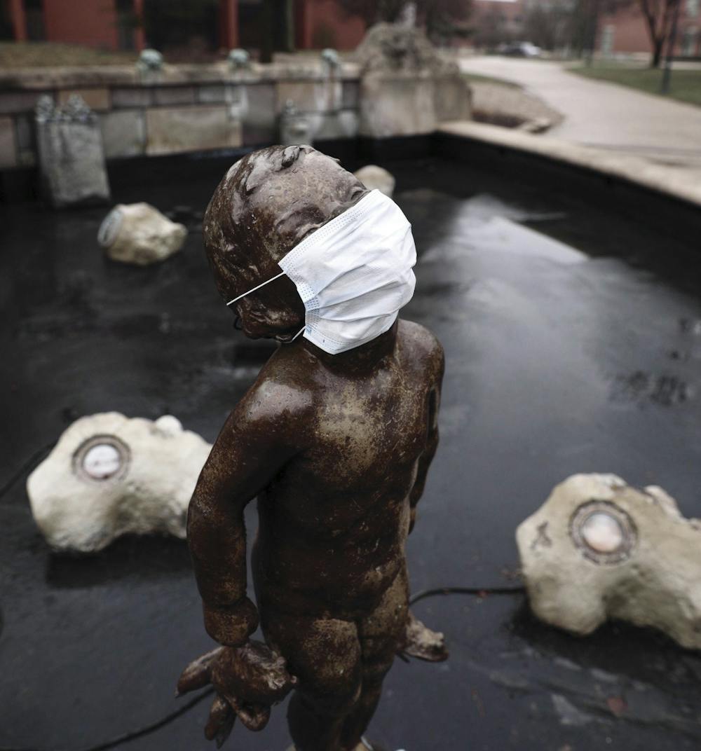 <p>Frog Baby stands without water in a facemask March 16, 2020. March 16 was the first day of fully-online classes in the spring 2020 semester due to the coronavirus pandemic. <strong>Jacob Musselman, DN File</strong></p>