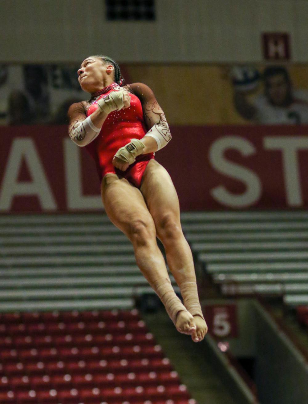 Third-year Victoria Henry spins through the air during her vault routine at the Ball State Quad Meet on Jan. 29 at Worthen Arena. Henry scored a 9.825. Katelyn Howell, DN.