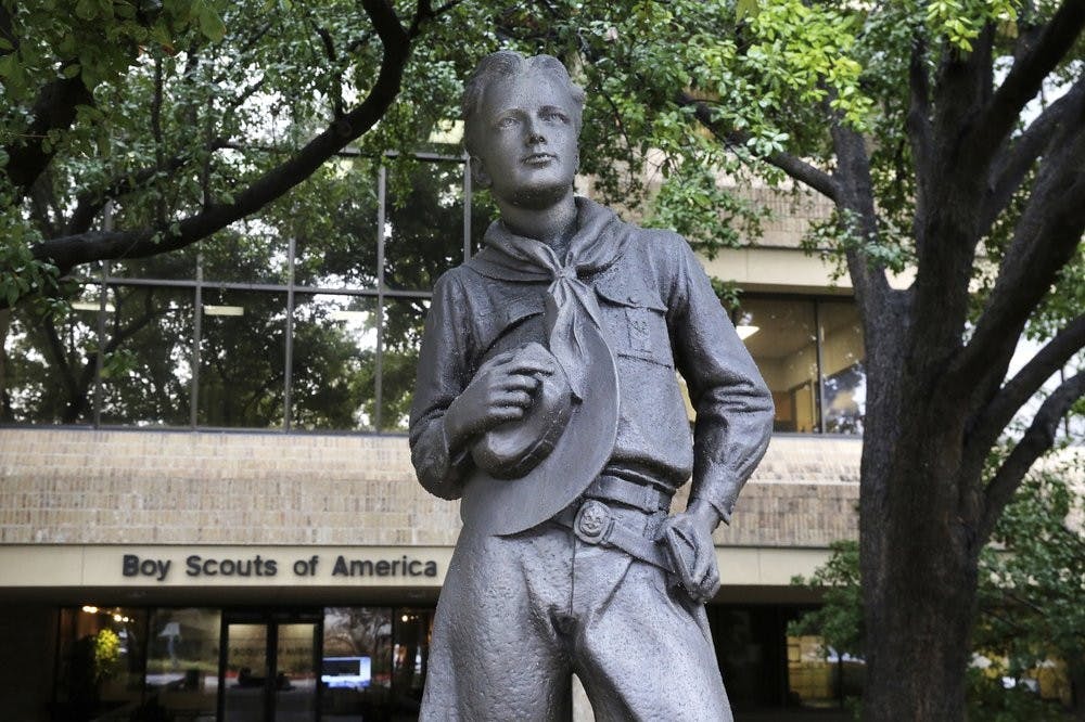 In this Feb. 12, 2020, photo, a statue stands outside the Boys Scouts of America headquarters in Irving, Texas. The Boy Scouts of America has filed for bankruptcy protection as it faces a barrage of new sex-abuse lawsuits. (AP Photo/LM Otero)
