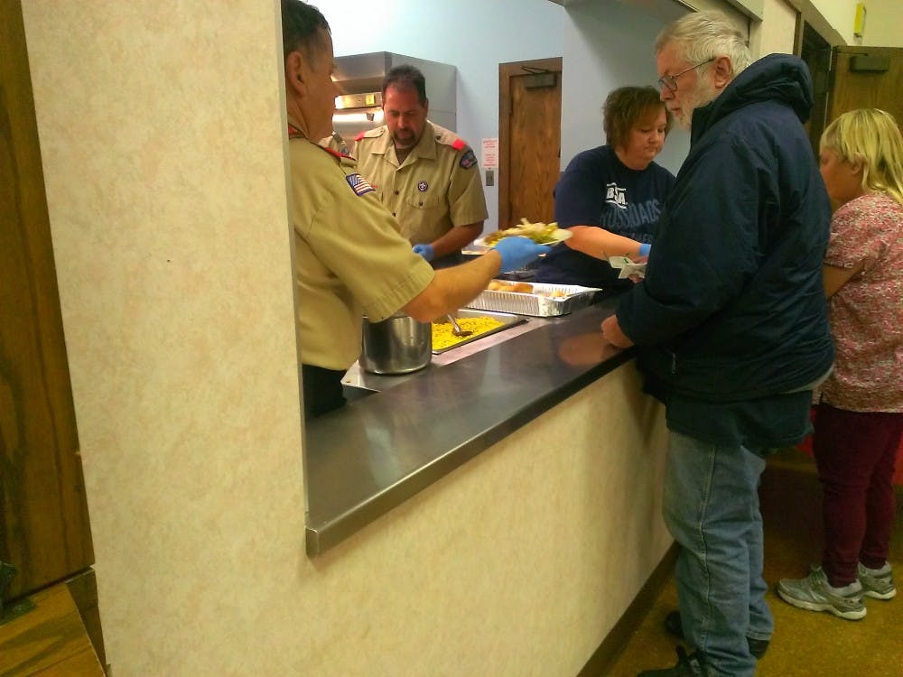 	Muncie Boy Scouts give a Thanksgiving meal to people in need on November 23. The Boy Scouts teamed up with Muncie Fire Department to feed around 325 people. 