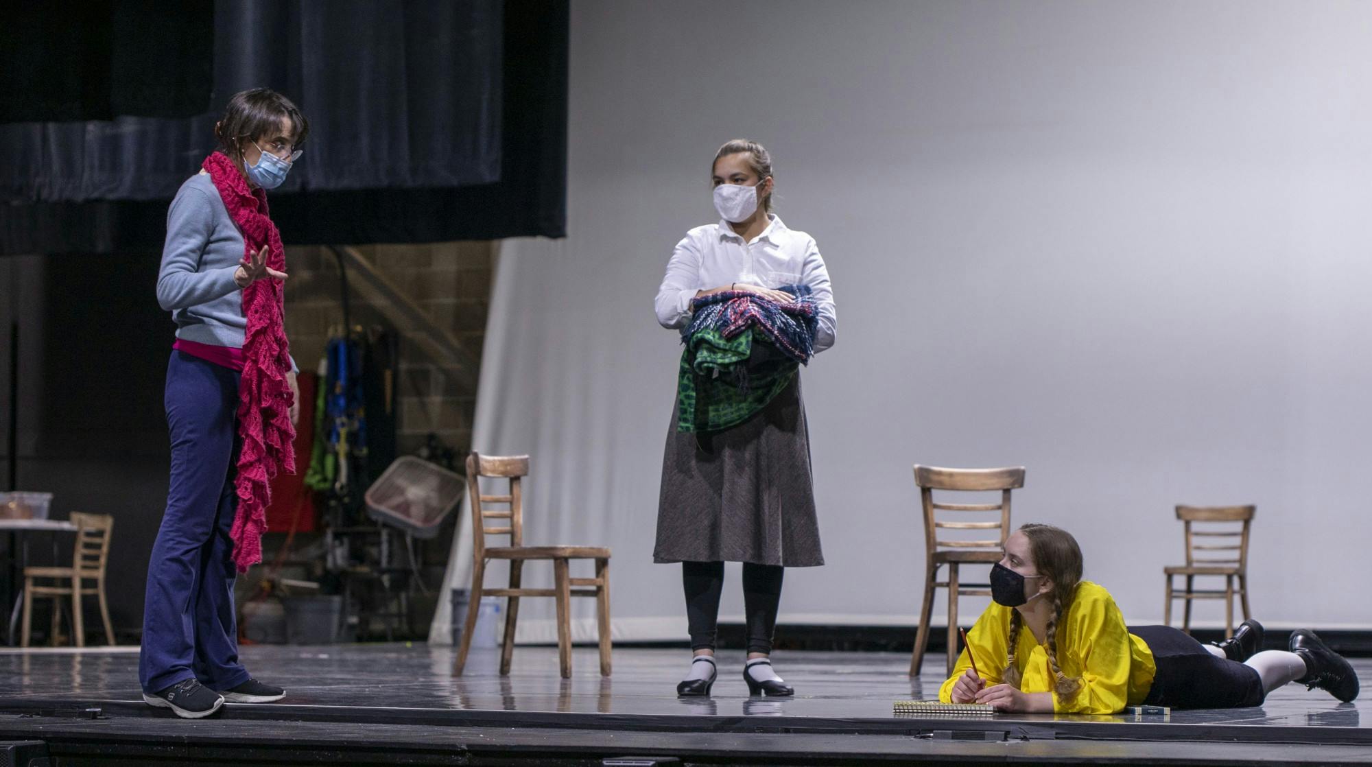 &quot;The Children&#x27;s Hour&quot; director Veronica Santoyo (left) remains socially distant from sophomore musical theatre major Teah Mirabelli (center) and sophomore acting major Laila Malak (right) at rehearsal in University Theatre Oct. 6, 2020. “The Children’s Hour” will open in University Theatre Oct. 15 with all performers and audience members wearing masks. Jaden Whiteman, DN