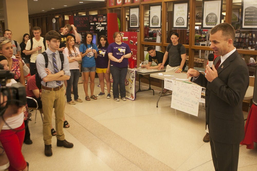 Men's basketball coach James Whitford speaks to students who gathered in the Atrium to meet the new coach on Wednesday. Whitford was introduced officially during a press conference earlier in the day. DN PHOTO JORDAN HUFFER