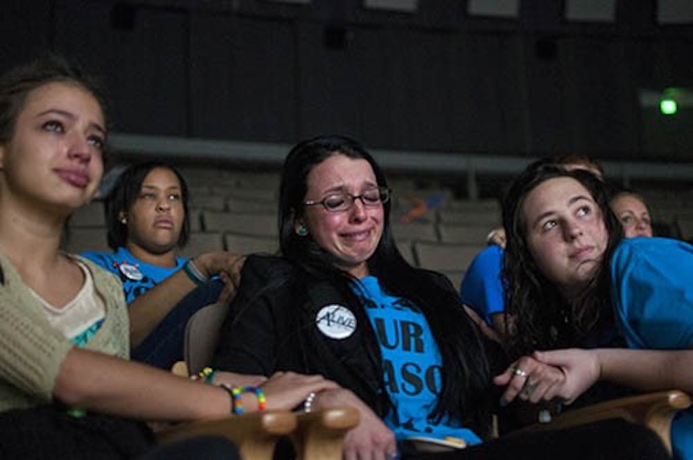 Alive Campaign president Carmen Diaz, center, cries while being comforted by Jessica Mangno, left, and Katherine Berning. Diaz lost her father Ricardo to suicide. The Alive Campaign was started at Ball State in 2008 and is in its first year without its founding members. The group is currently attempting to promote “reasons to live” a campaign that focuses on reminding people of the good things in their lives. DN PHOTO BOBBY ELLIS