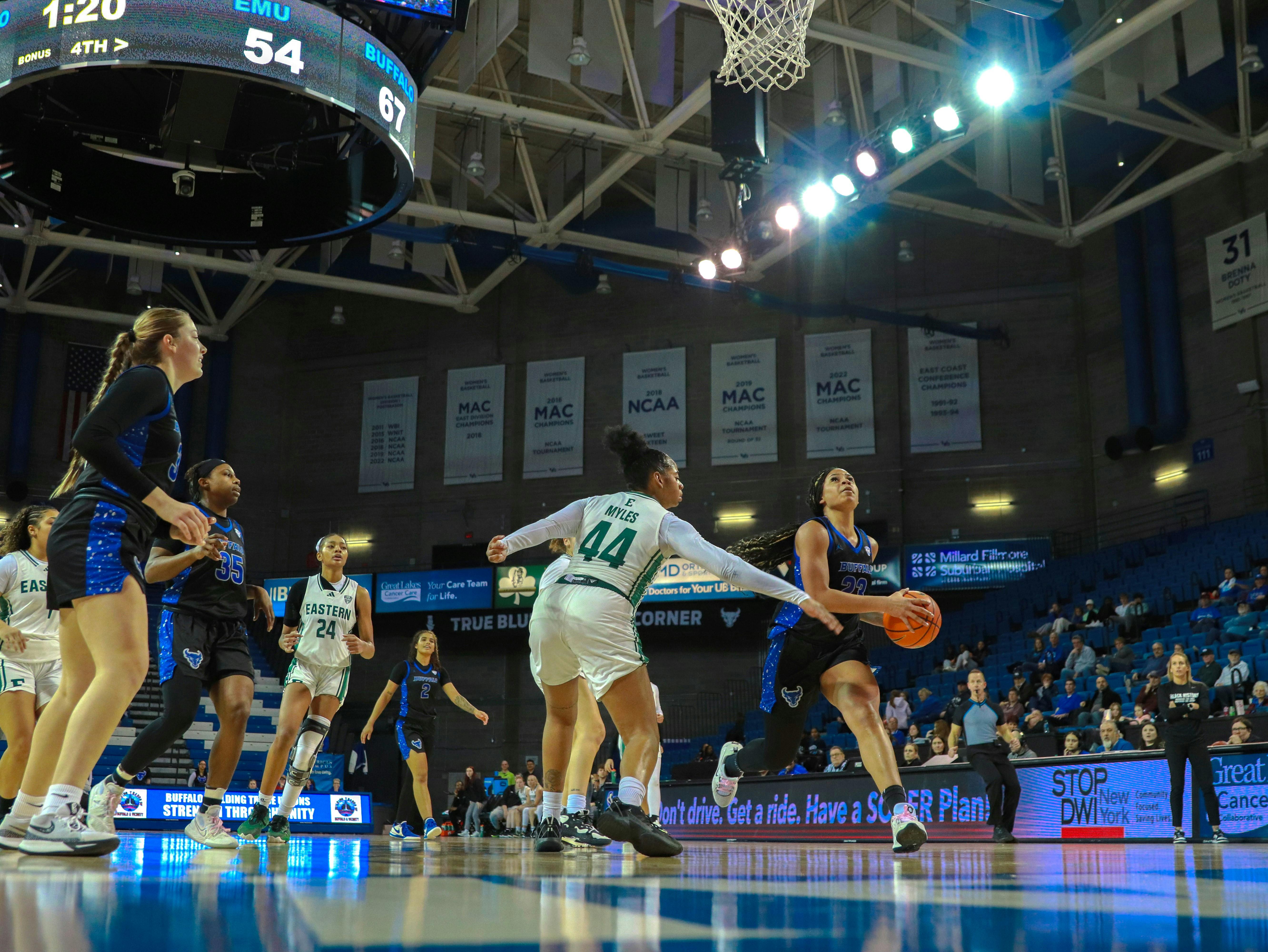 Freshman guard Alexis Davis, No. 23, goes up for a layup against Eastern Michigan University.