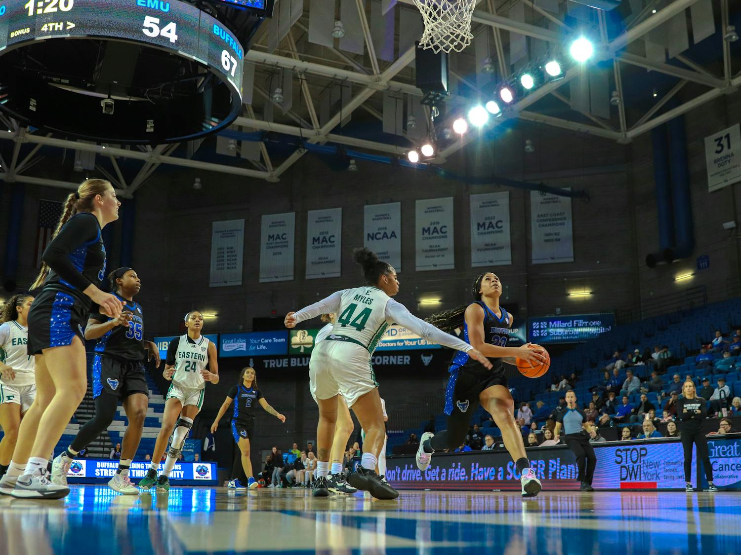 Freshman guard Alexis Davis, No. 23, goes up for a layup against Eastern Michigan University.