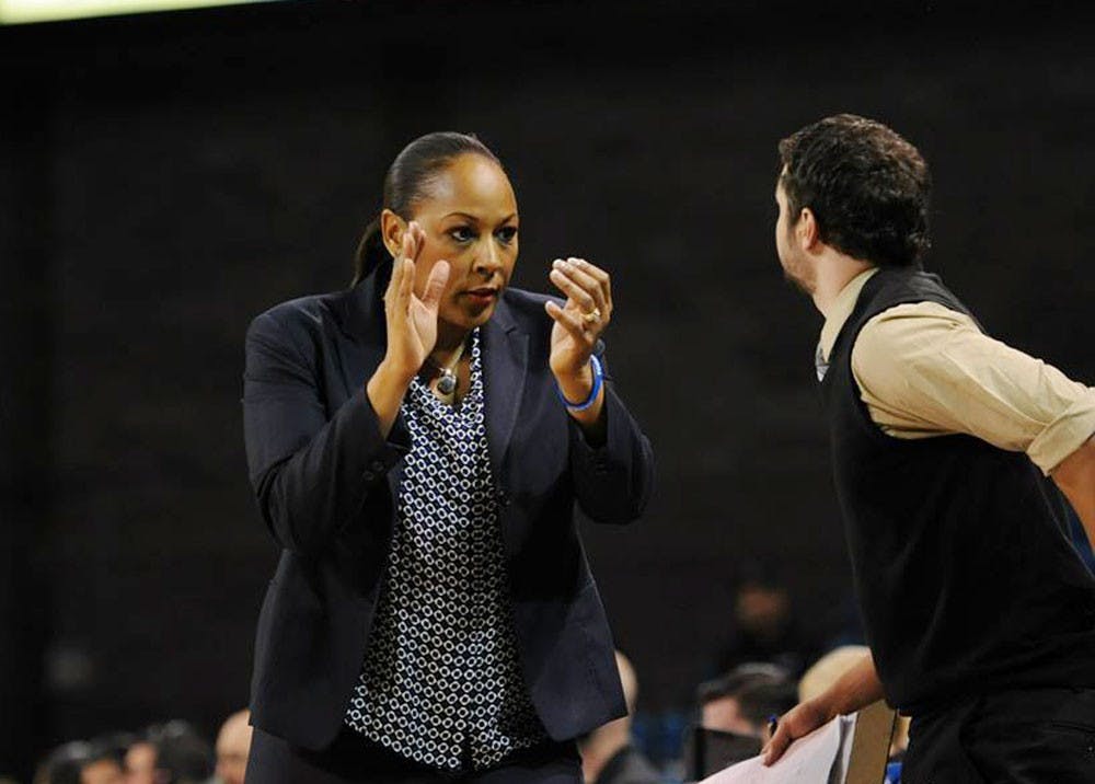 <p>Bulls head coach Felisha Legette-Jack claps with an assistant head coach. After losing her top four players, Legette-Jack expressed excitement about the team’s new nucleus.</p>