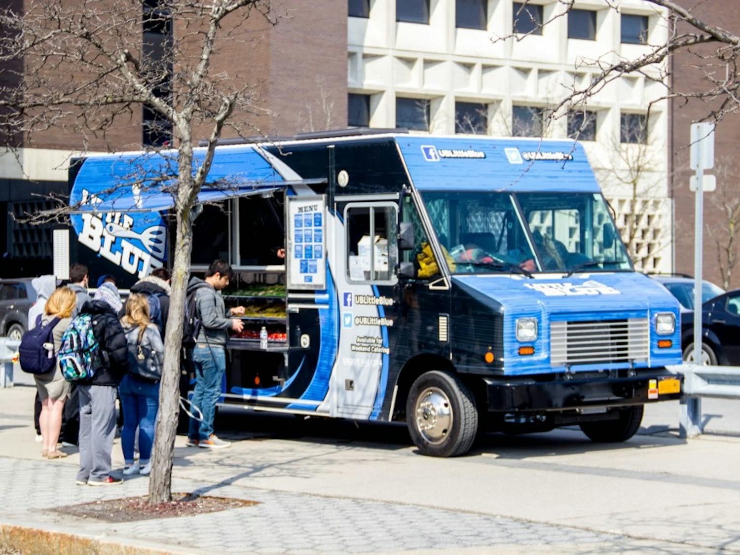 Students standing in front of “Big Blue” food truck to order their lunch. The “Big Blue” and “Little Blue” food trucks are owned by the Faculty-Student Association and are the only trucks allowed to serve on UB’s campus.