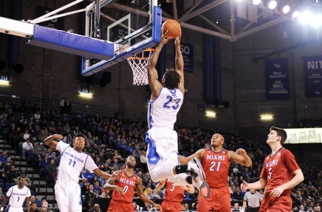 Junior forward Justin Moss scored a career-high 31 points and grabbed 15 rebounds and was named to the Henson Mid-season Watch list over winter break. Yusong Shi, The Spectrum.
