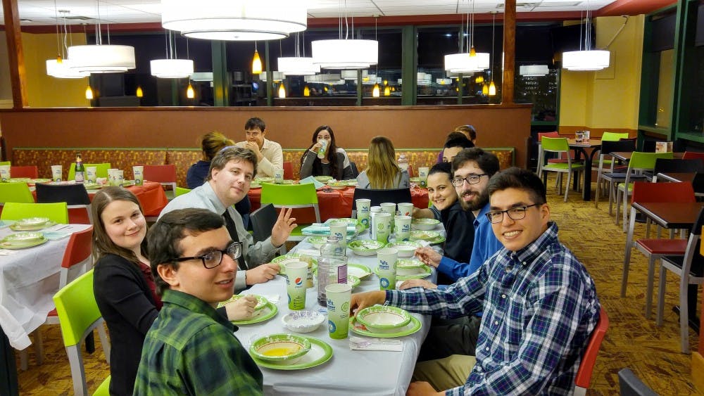 <p>Students attend a Seder during last year's Passover.&nbsp;</p>