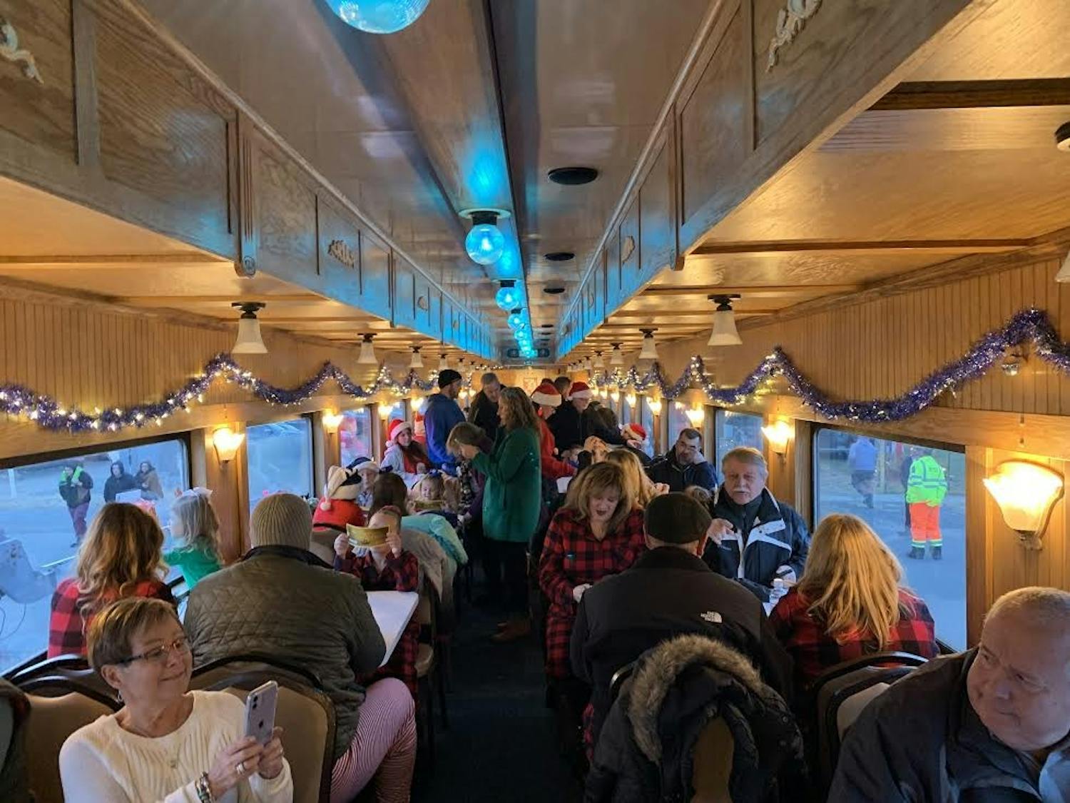 Passengers take their seats and eagerly await the train's departure to the North Pole.