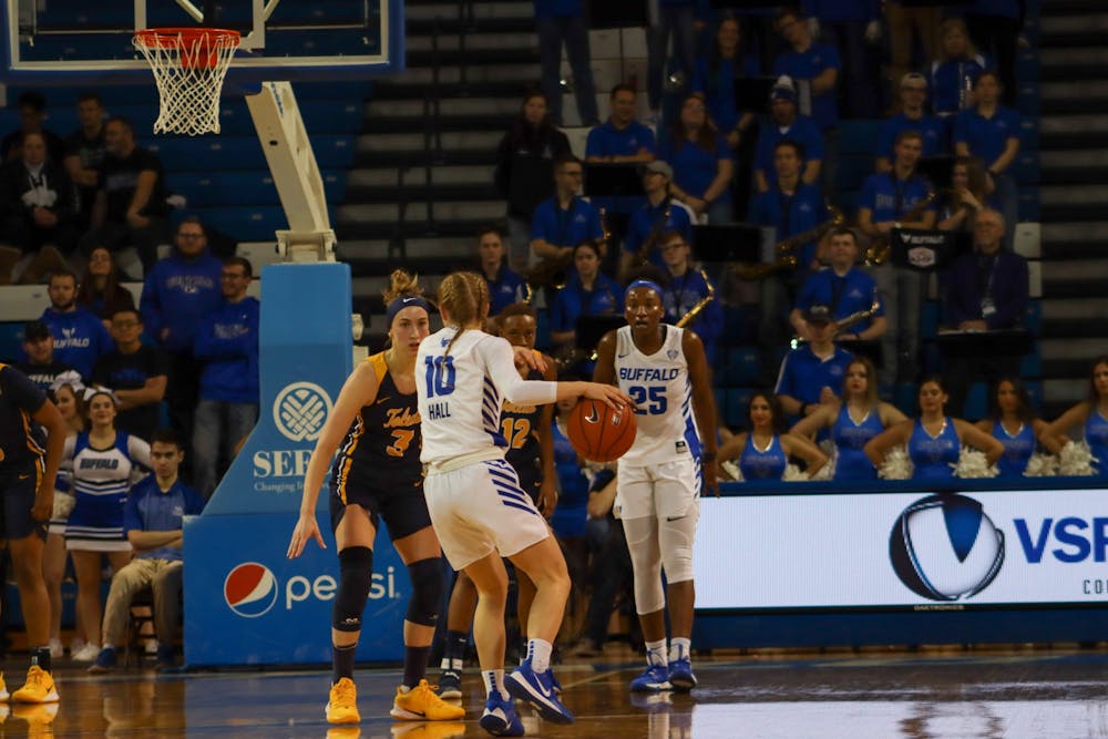 <p>Junior guard Hanna Hall dribbles the ball at Saturday's game against Toledo.</p>