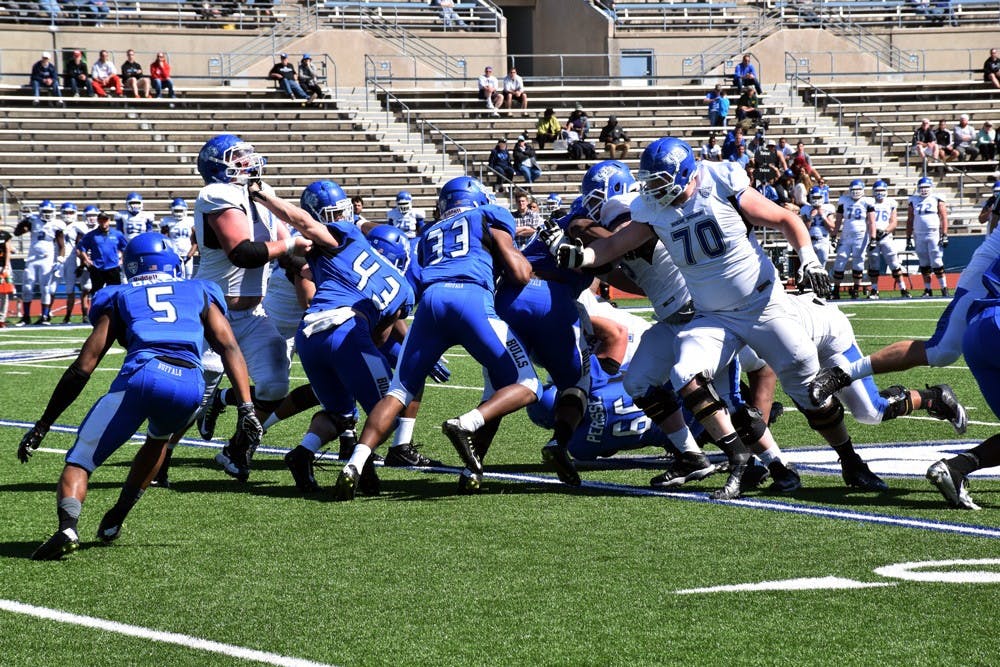 <p>Sophomore Brandon Berry, a defensive back, is blitzing at the defensive line. Lance Leipold’s 4-3 system allows for plays like this and will start with the four front linemen, most of whom will be new to the position.</p>