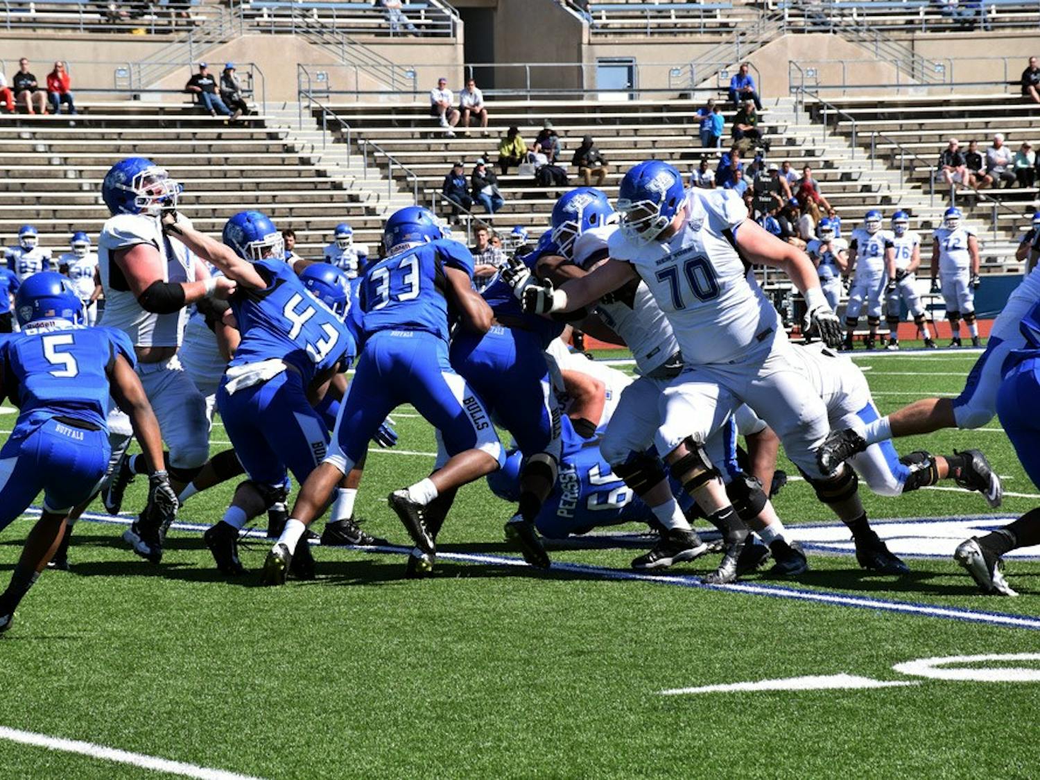 Sophomore Brandon Berry, a defensive back, is blitzing at the defensive line. Lance Leipold’s 4-3 system allows for plays like this and will start with the four front linemen, most of whom will be new to the position.