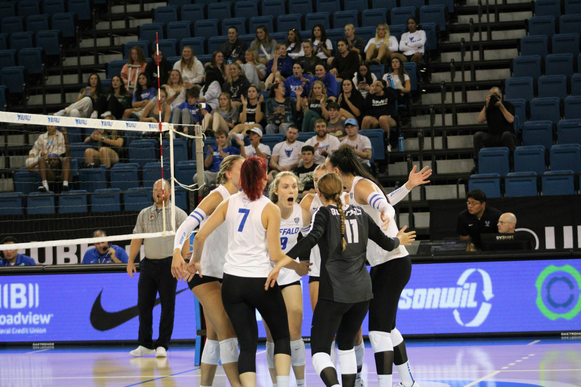 Women's volleyball celebrates during a game against Ohio University.&nbsp;