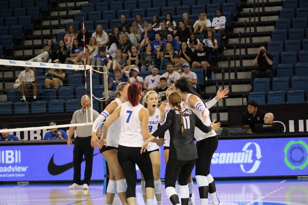 <p>Women's volleyball celebrates during a game against Ohio University.&nbsp;</p>