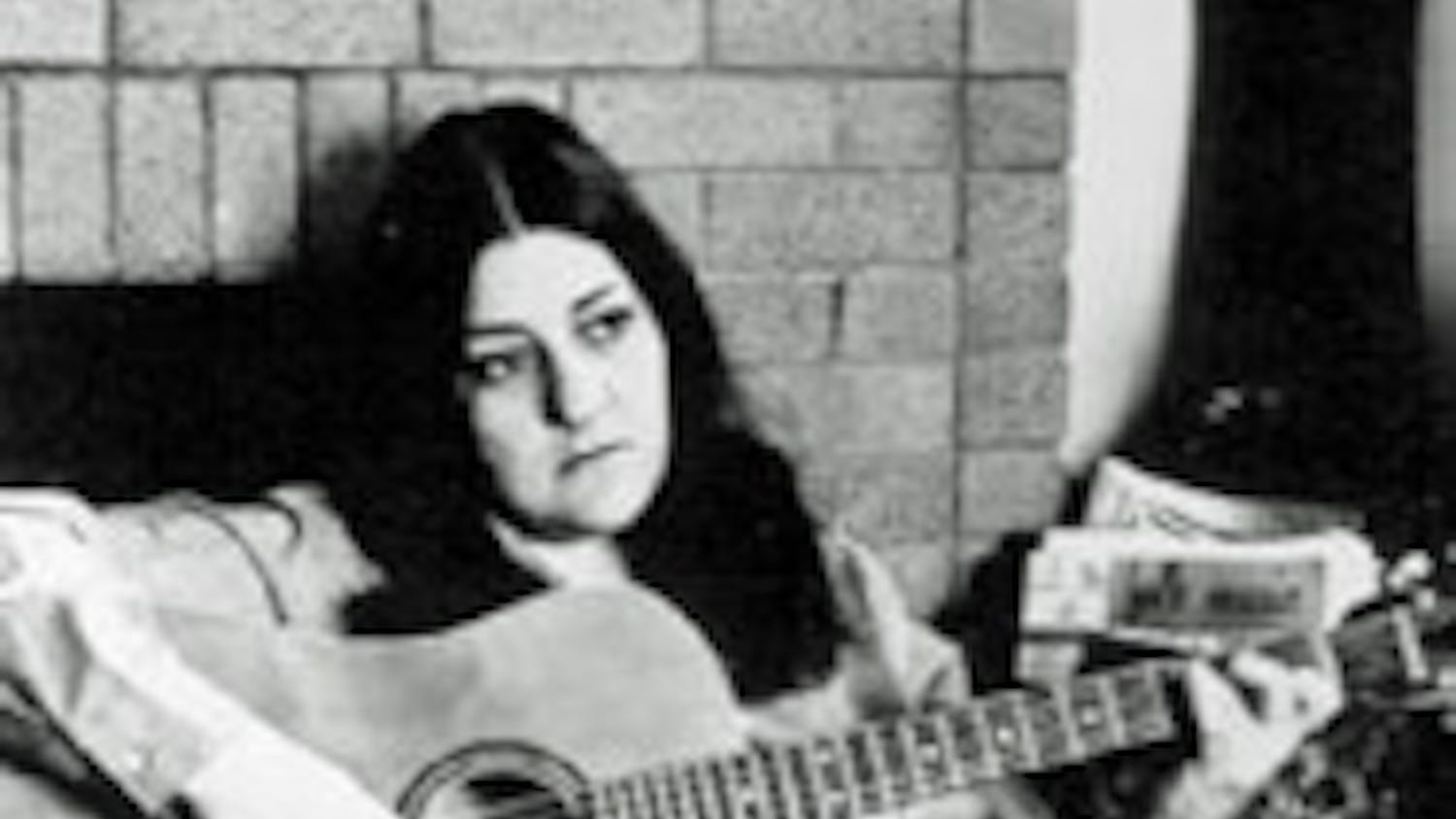 Madeline Davis playing the guitar