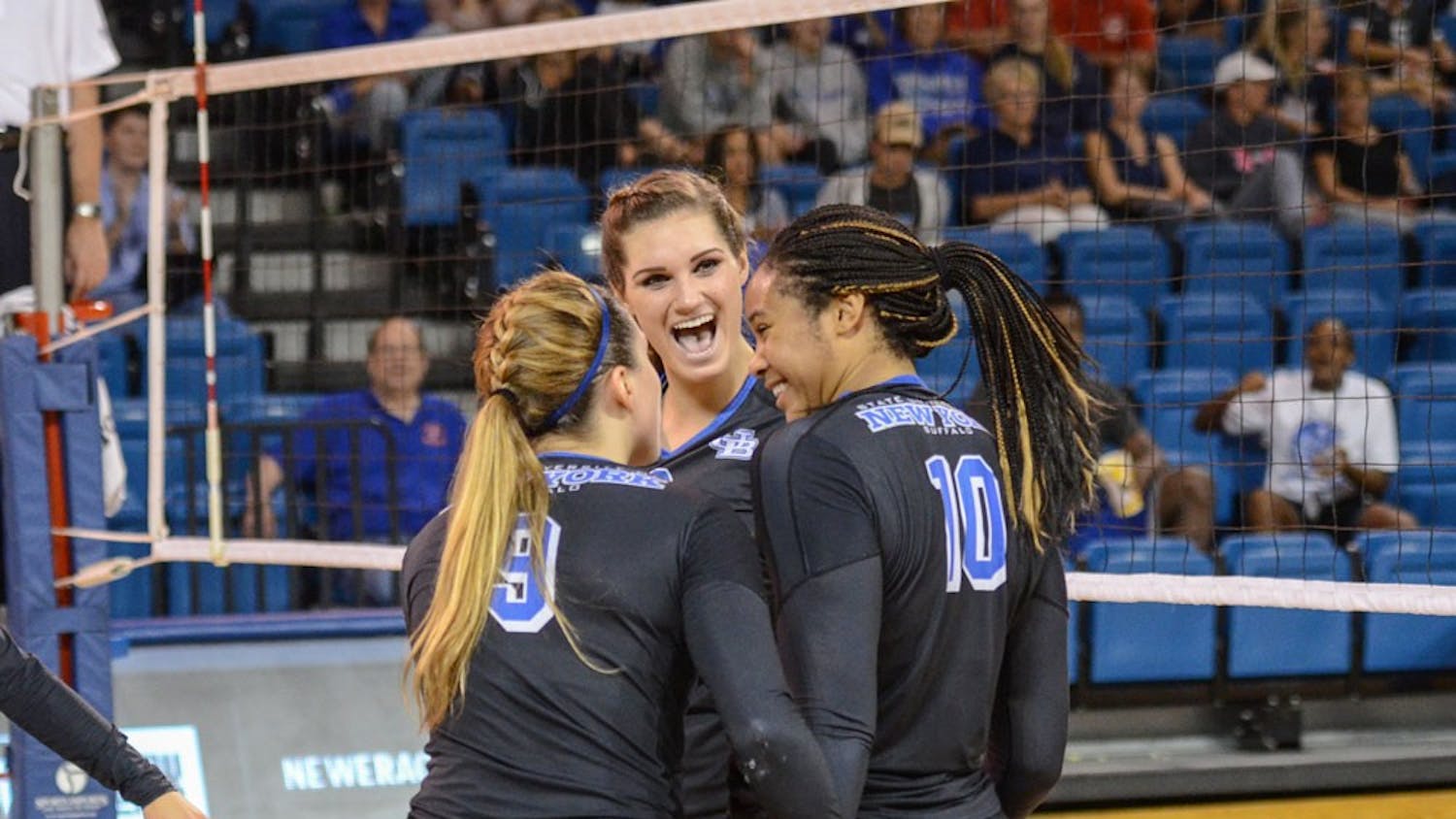 (From left to right) Senior outside hitter Marissa Prinzbach, freshman middle blocker Megan Wernette and senior middle blocker Akeila Lain celebrate in a&nbsp;game in Alumni Arena earlier this season. The Bulls' season ended Thursday night with a 3-1 loss to Ball State in the MAC Tournament.&nbsp;