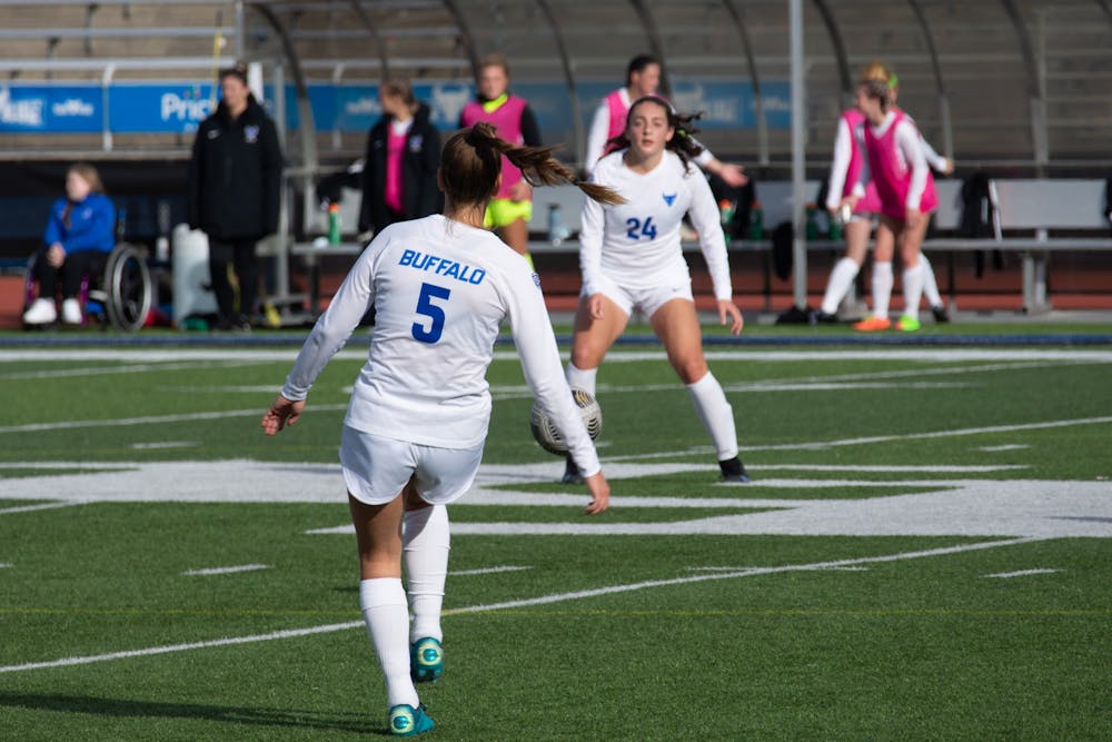 Junior defenseman Emily Lazenby (5) and freshman midfielder Kaya Schultz (24) pass the ball during a recent game. UB lost to Bowling Green 1-0 in the MAC semifinals Thursday.