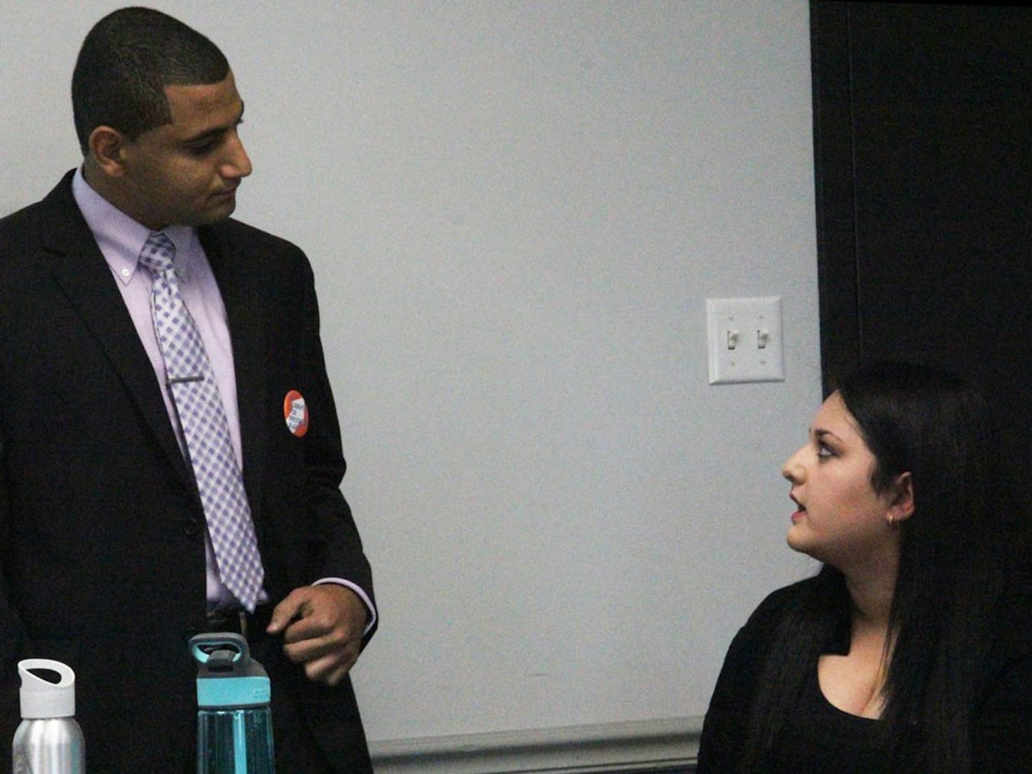 Yaser Soliman (left) speaks to senator Alexis Ogra (right) during his senate chair election speech. Soliman lost the election, which SA's own attorney says was invalid, and is advocating for more university oversight of the Student Association. 
