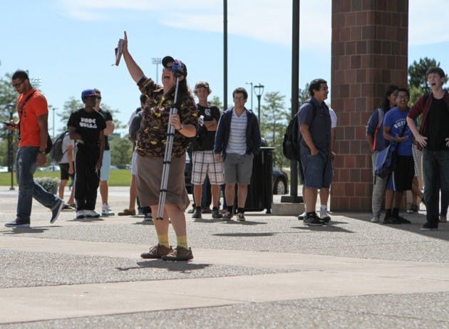 A crowd of over 150 students gathered outside in Founder&rsquo;s Plaza Monday, Sept. 8, while a self-proclaimed missionary shouted her religious beliefs. She was led away by UPD as students filmed her on their cellphones.&nbsp;Chad Cooper, The Spectrum