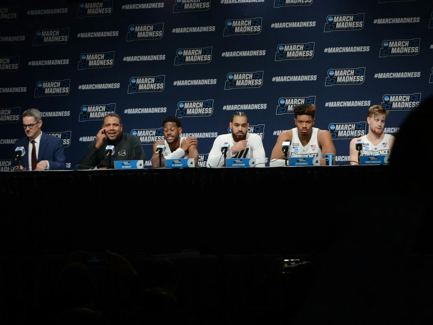Head coach Ed Cooley (second from left) and members of the Providence Friars men's basketball team answer questions from the media following the team's 66-57 victory over South Dakota State Thursday.