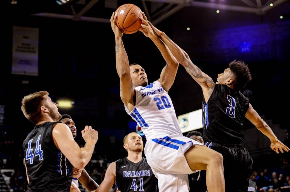 <p>Senior forward Rodell Wigginton goes to the basket against Daemen in Alumni Arena earlier this season. Wigginton had a team-high 17 points against VCU Tuesday night.&nbsp;</p>