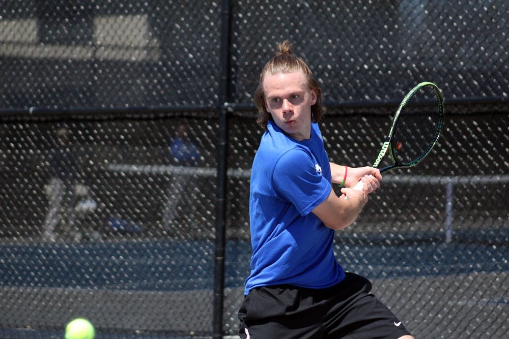 <p>Freshman Villhelm Fridell preparing to hit the tennis ball. The men’s tennis team won the MAC championship on Saturday.</p>