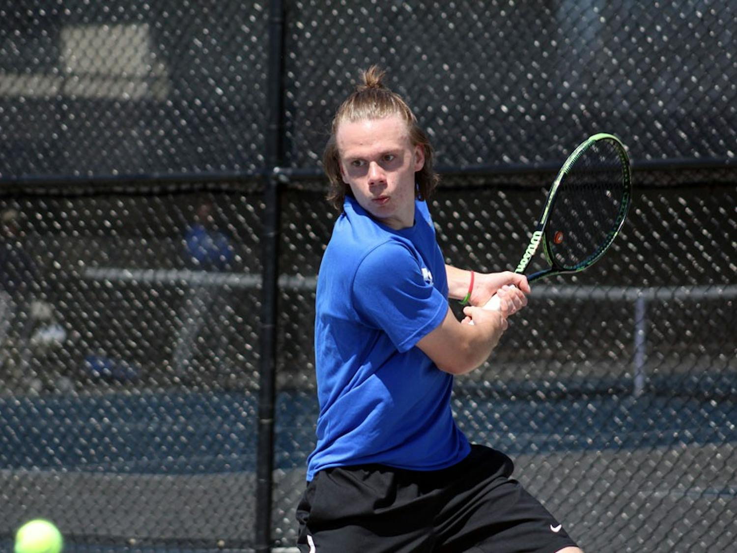 Freshman Villhelm Fridell preparing to hit the tennis ball. The men’s tennis team won the MAC championship on Saturday.