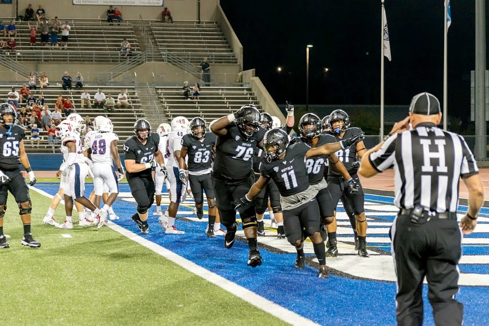 Redshirt freshman running back Theo Anderson celebrates with the Bulls after a touchdown. The run game will be key for the Bulls when they take on the Western Michigan Broncos Saturday at 3:30 p.m.