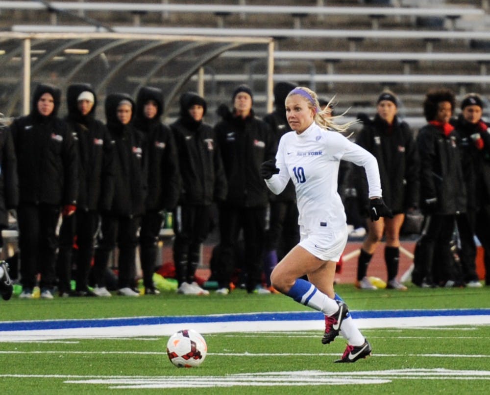 <p>Junior midfielder Dana Lytle dribbling a ball up the field. Lytle will be an important piece in the soccer team’s run to another conference championship.</p>