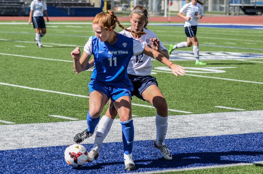 <p>Senior midfielder Kassidy Kidd attempts to keep the ball away from a defender against Kent State on Sunday. The Bulls went 1-1 to start Mid-American Conference play this weekend.</p>