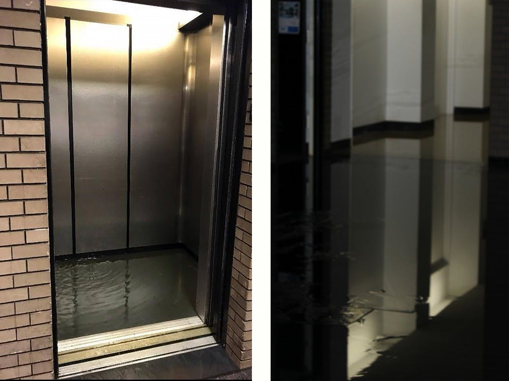 <p>An elevator in Clemens hall is filled with water. The flooding was a result of a burst water valve on the fourth floor cooling system.&nbsp;</p>
