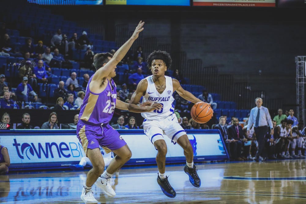 <p>Sophomore guard Ronaldo Segu on the perimeter setting up an offensive play against Nazareth.</p>